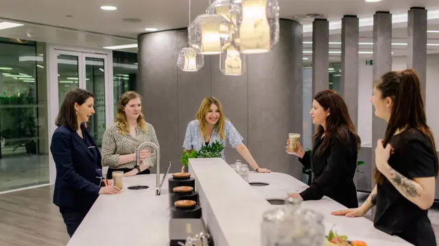 AmTrust offices, colleagues enjoying a TopBrewer coffee