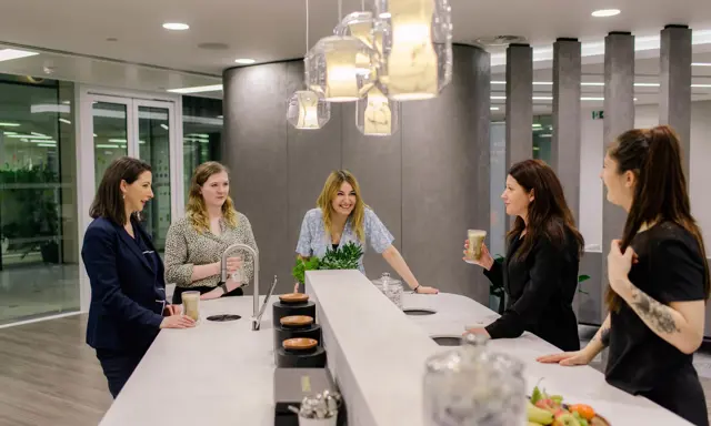 AmTrust offices, colleagues enjoying a TopBrewer coffee