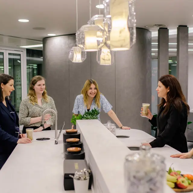 AmTrust offices, colleagues enjoying a TopBrewer coffee