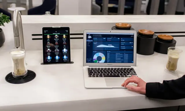 CoffeeCloud - TopBrewer's cloud management system, shown on laptop screen