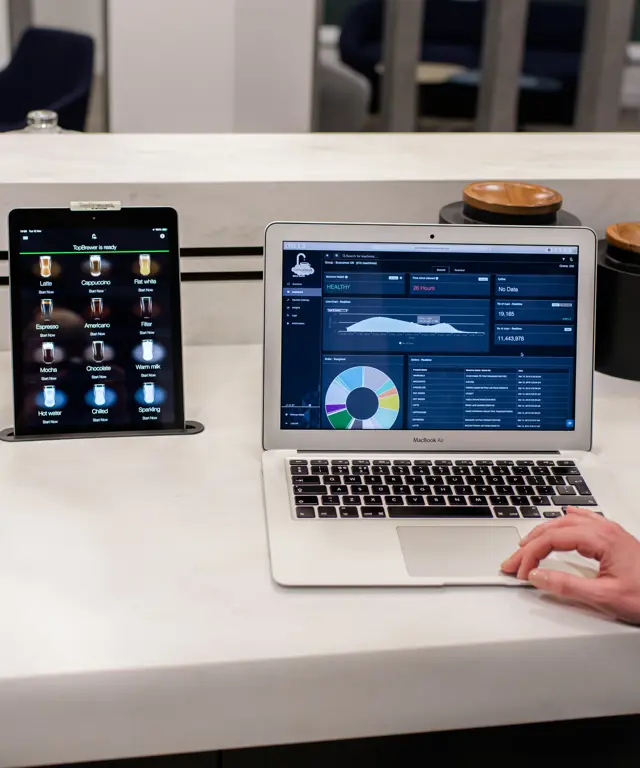 CoffeeCloud - TopBrewer's cloud management system, shown on laptop screen