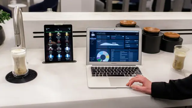 CoffeeCloud - TopBrewer's cloud management system, shown on laptop screen