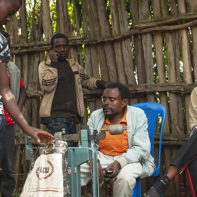 Scanomat sourcing team visiting a direct trade coffee farm to establish stable pricing agreements.