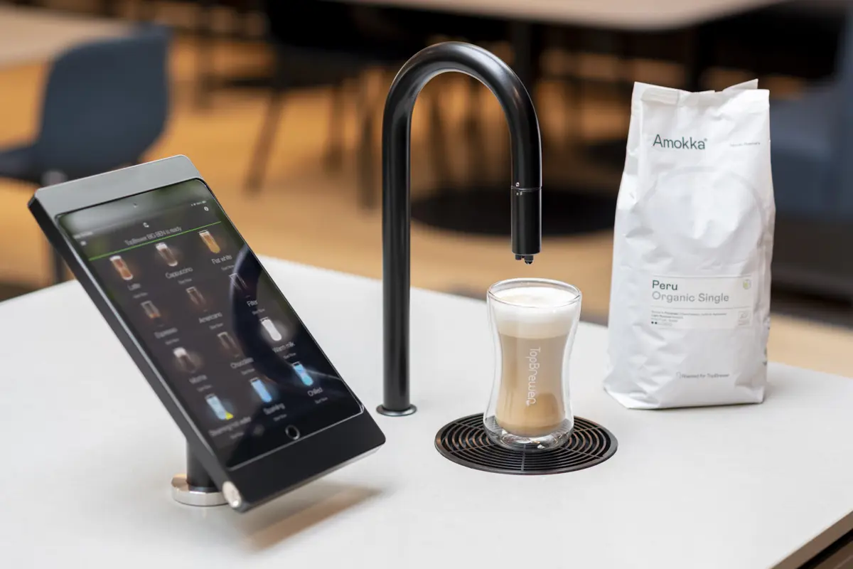 Image showing matte black TopBrewer with deluxe iPad holder and bag of Amokka coffee next to it