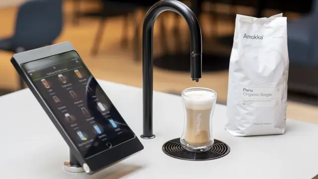 Image showing matte black TopBrewer with deluxe iPad holder and bag of Amokka coffee next to it