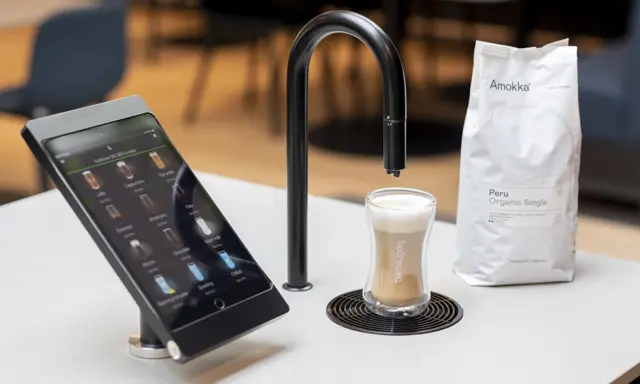 Image showing matte black TopBrewer with deluxe iPad holder and bag of Amokka coffee next to it